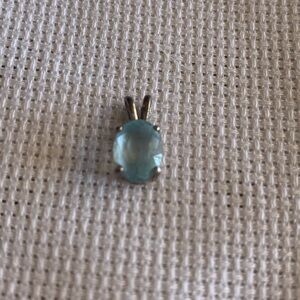 Vintage Lab Created Oval Blue Topaz Pendant set in Sterling Silver